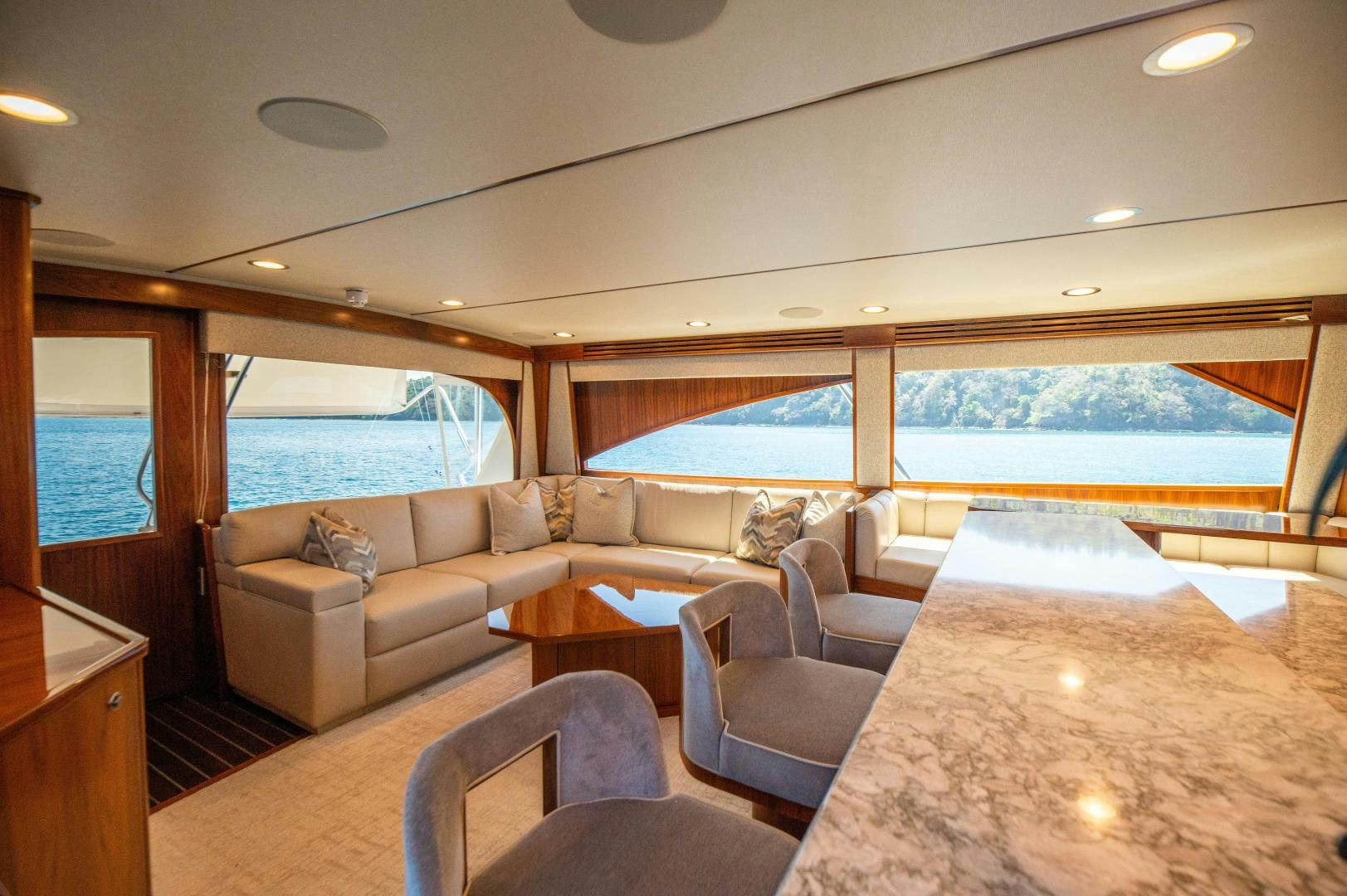 a living room with a large window aboard RAGIN CAJUN Yacht for Sale
