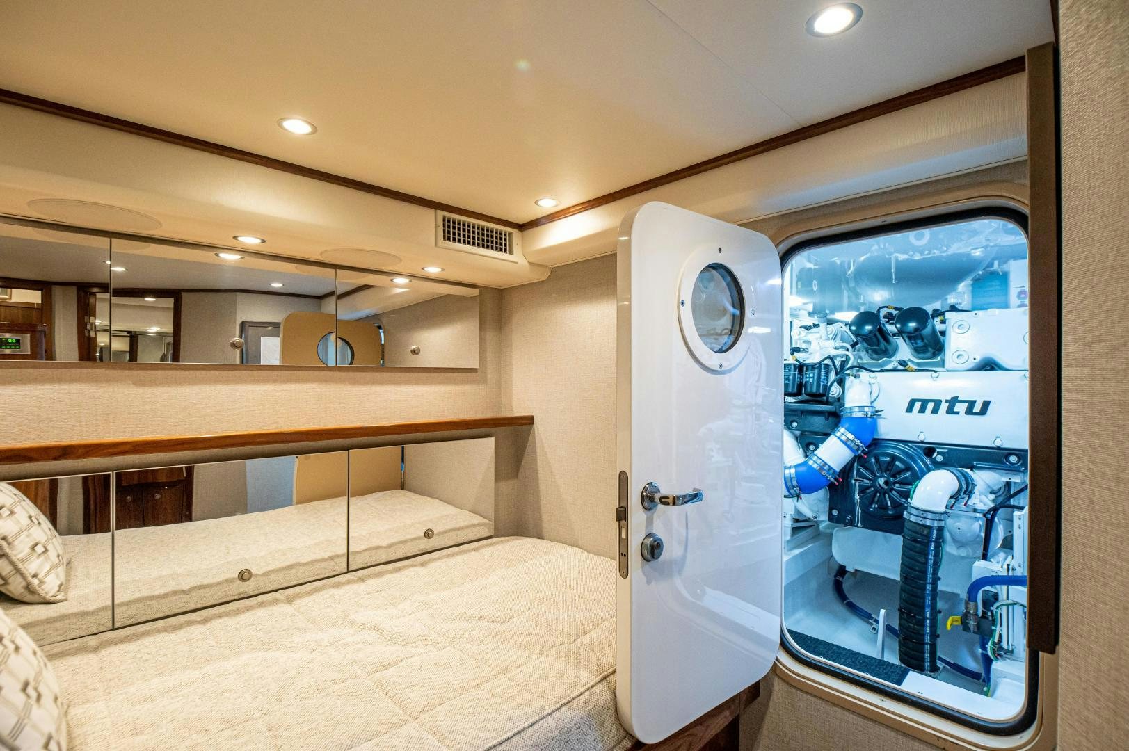 a room with a bed and a large machine aboard RAGIN CAJUN Yacht for Sale