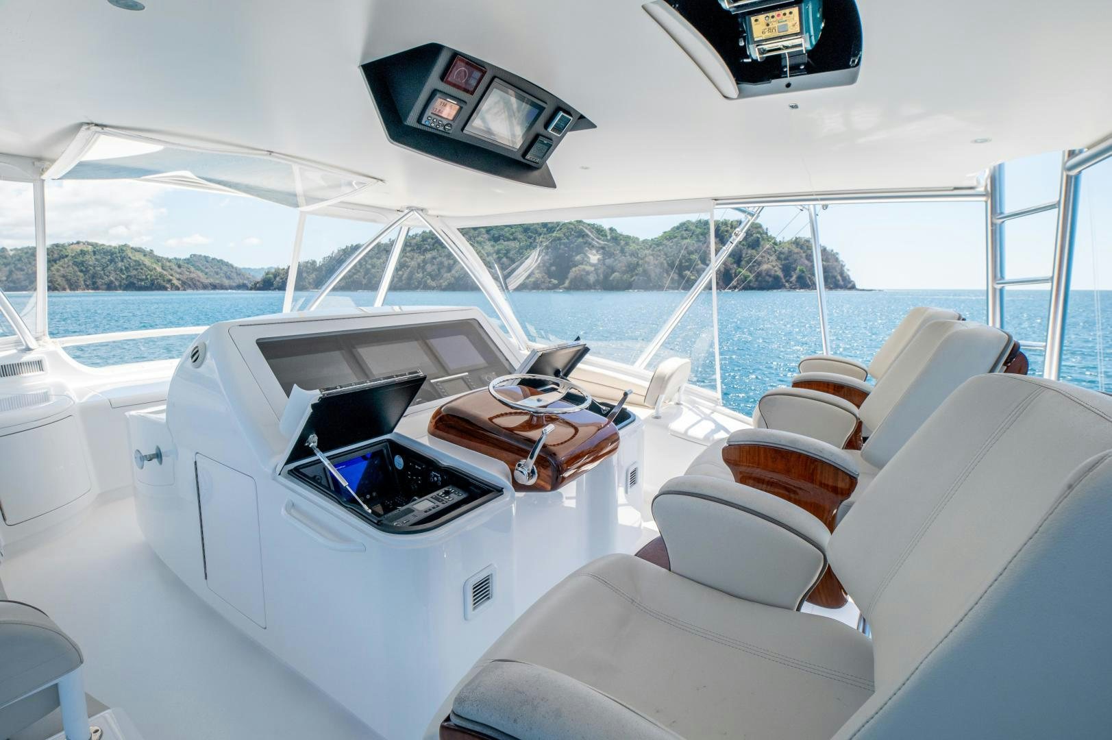 a yacht with a laptop on the deck aboard RAGIN CAJUN Yacht for Sale