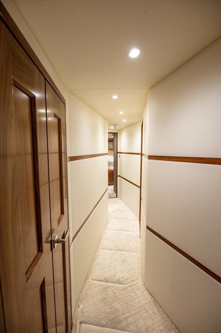 a hallway with doors aboard RAGIN CAJUN Yacht for Sale