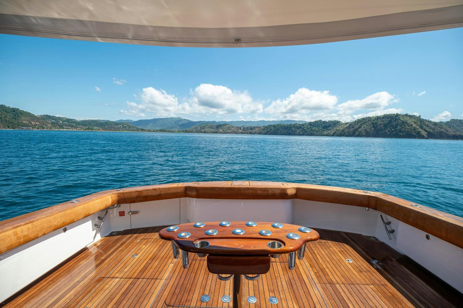 a wood table on a boat aboard RAGIN CAJUN Yacht for Sale