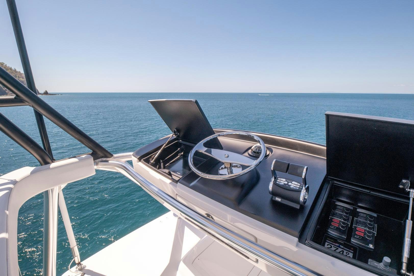 a boat with a steering wheel aboard RAGIN CAJUN Yacht for Sale