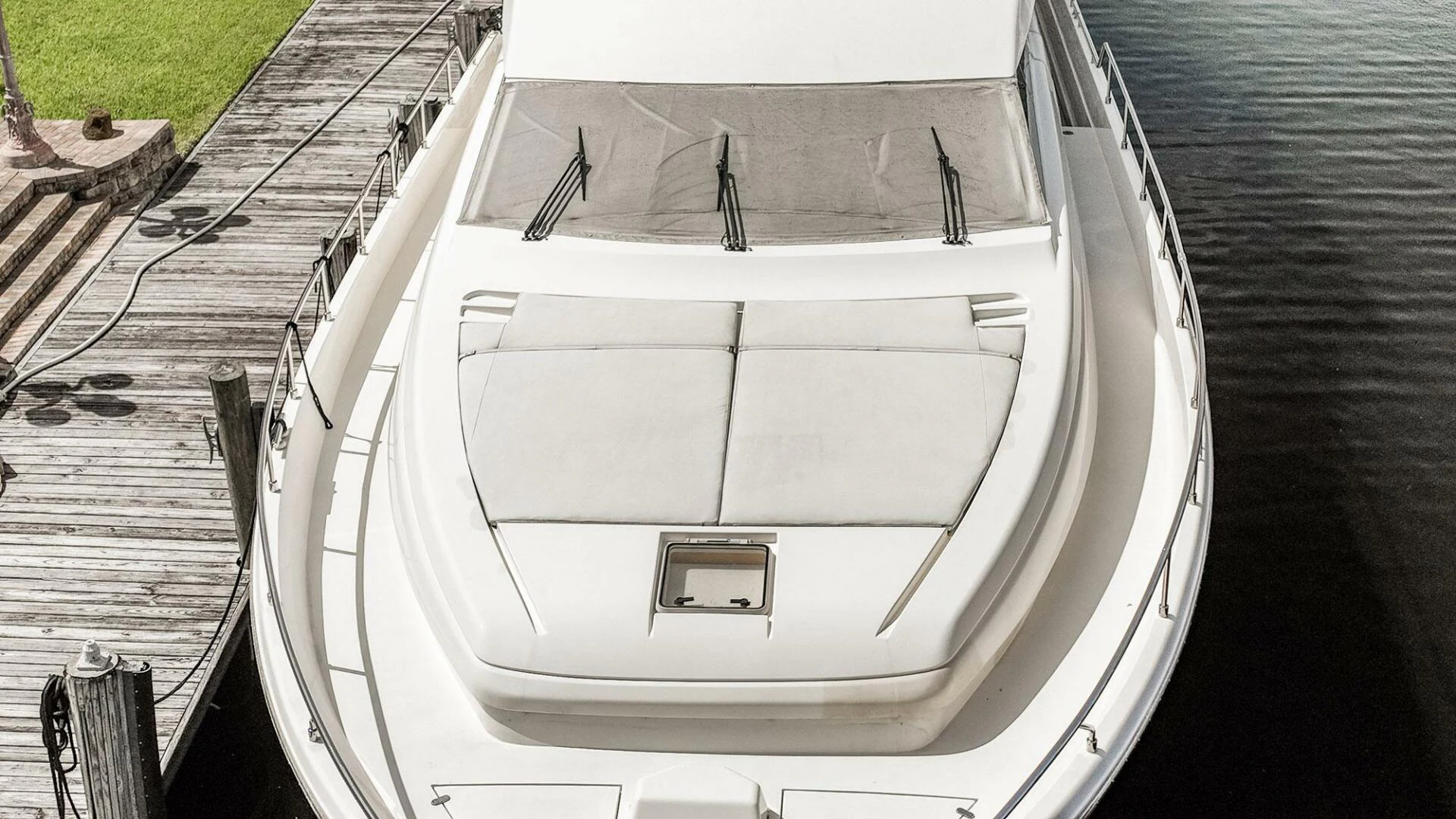 a white boat on a dock aboard RABBIT Yacht for Sale