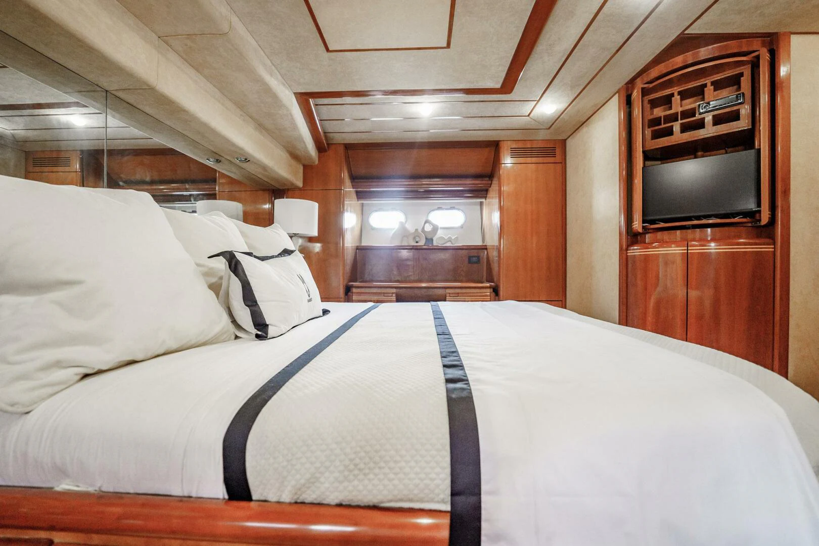 a bed with white sheets aboard RABBIT Yacht for Sale