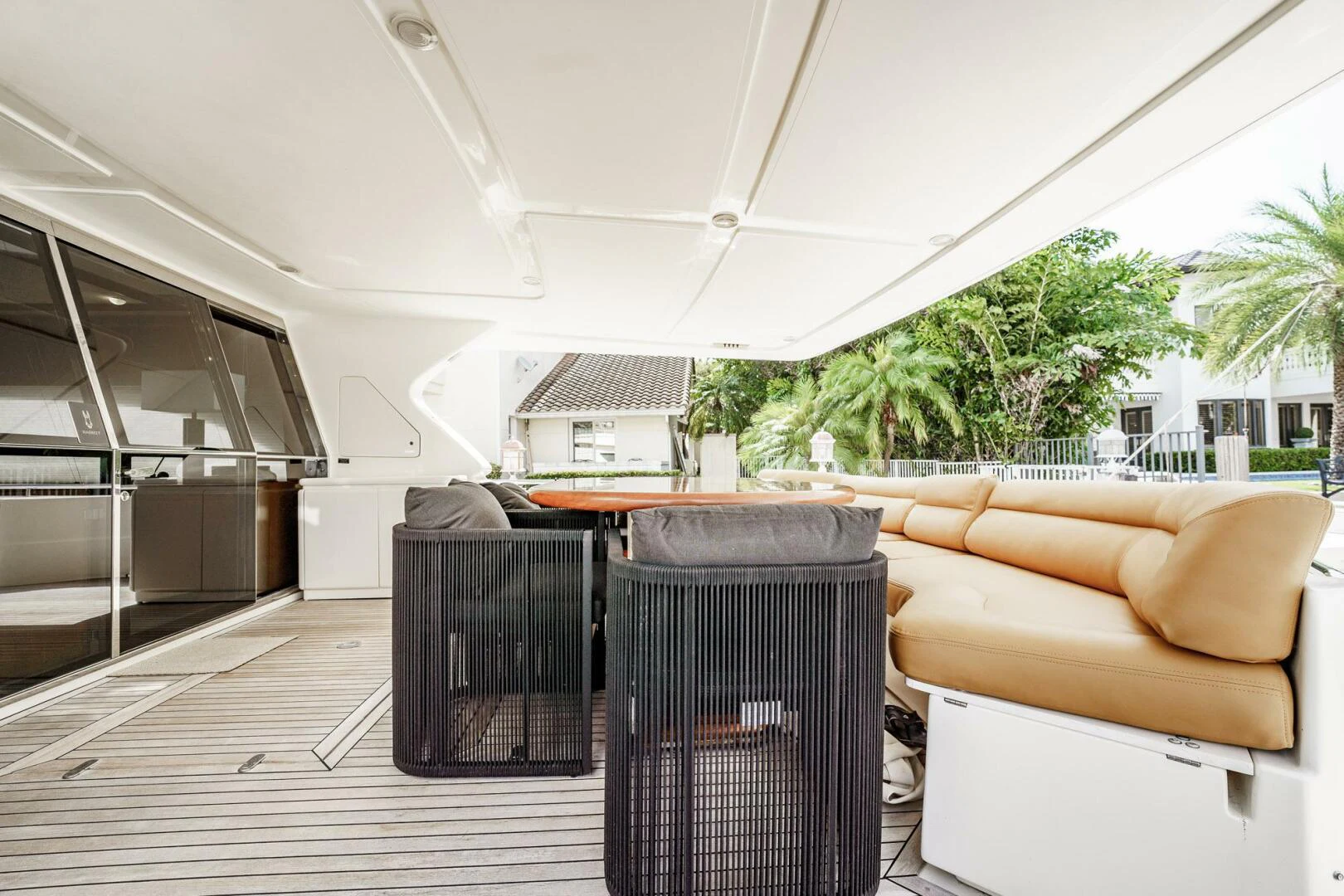 a large white tent with a large table and chairs aboard RABBIT Yacht for Sale