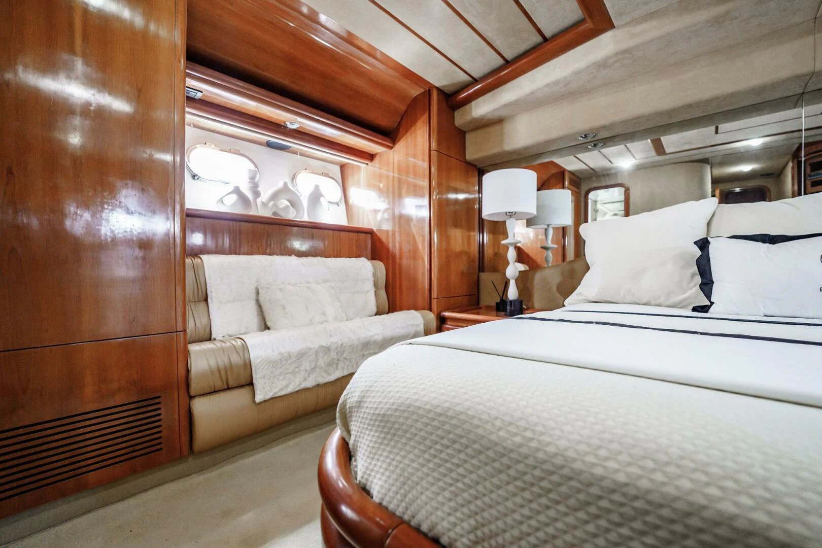 a room with a bed and a couch aboard RABBIT Yacht for Sale
