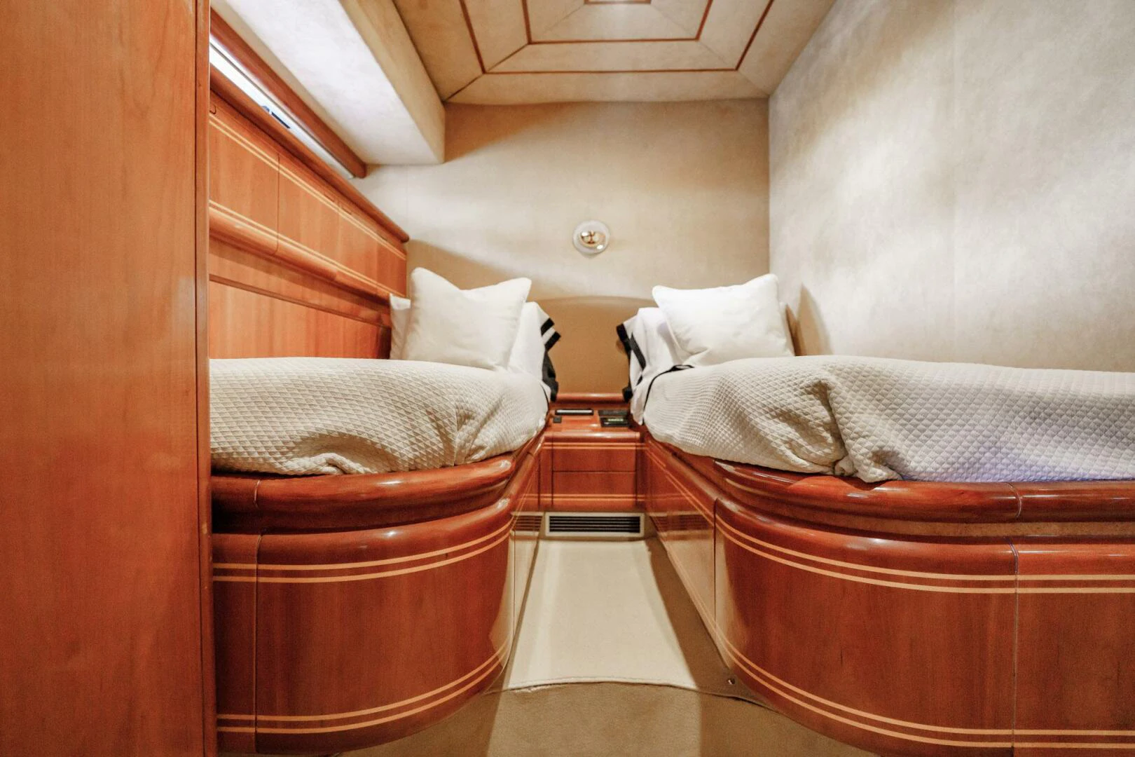 a room with a bed and a chair aboard RABBIT Yacht for Sale