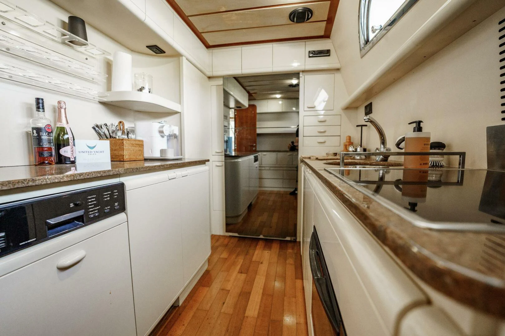 a kitchen with white cabinets aboard RABBIT Yacht for Sale