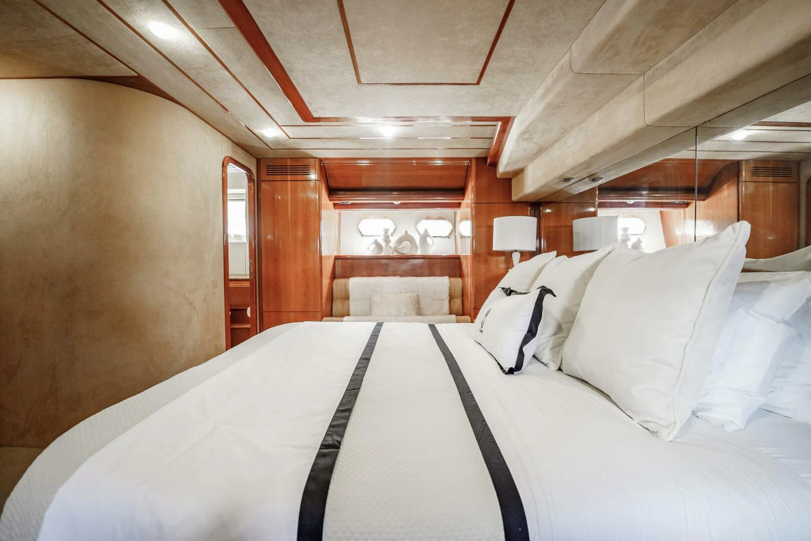 a bed with white sheets aboard RABBIT Yacht for Sale