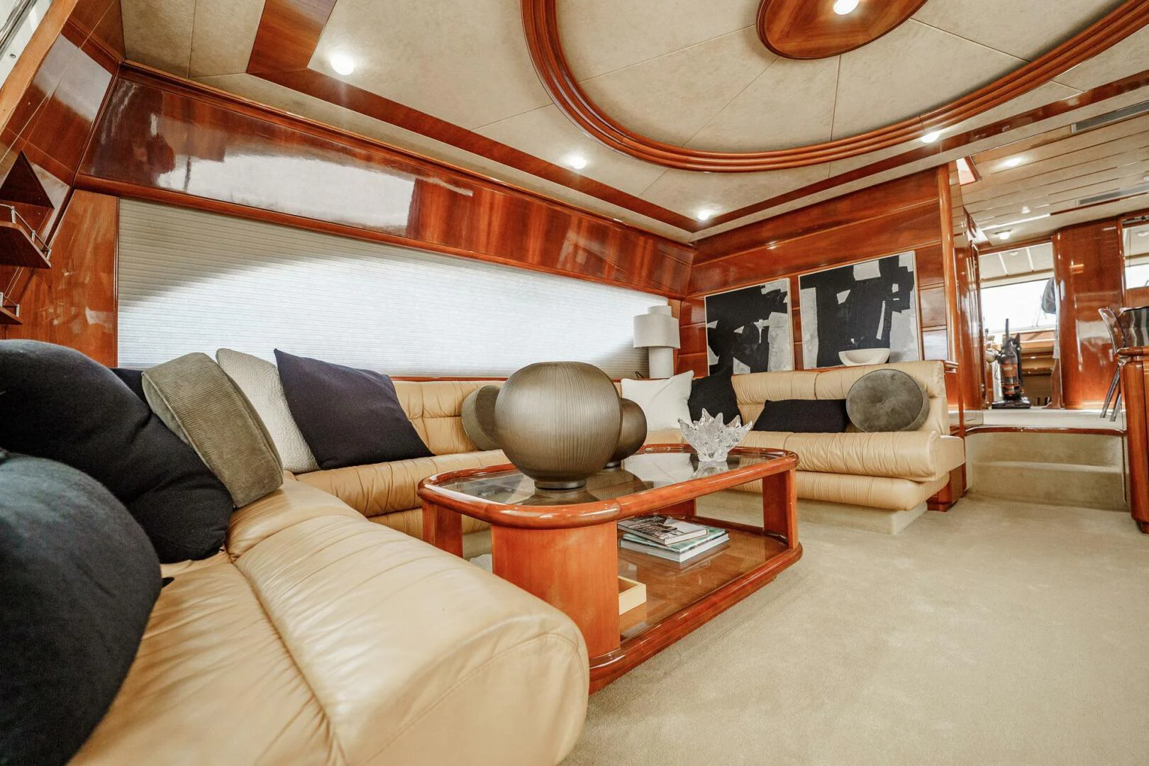 a large living room with a large mirror aboard RABBIT Yacht for Sale