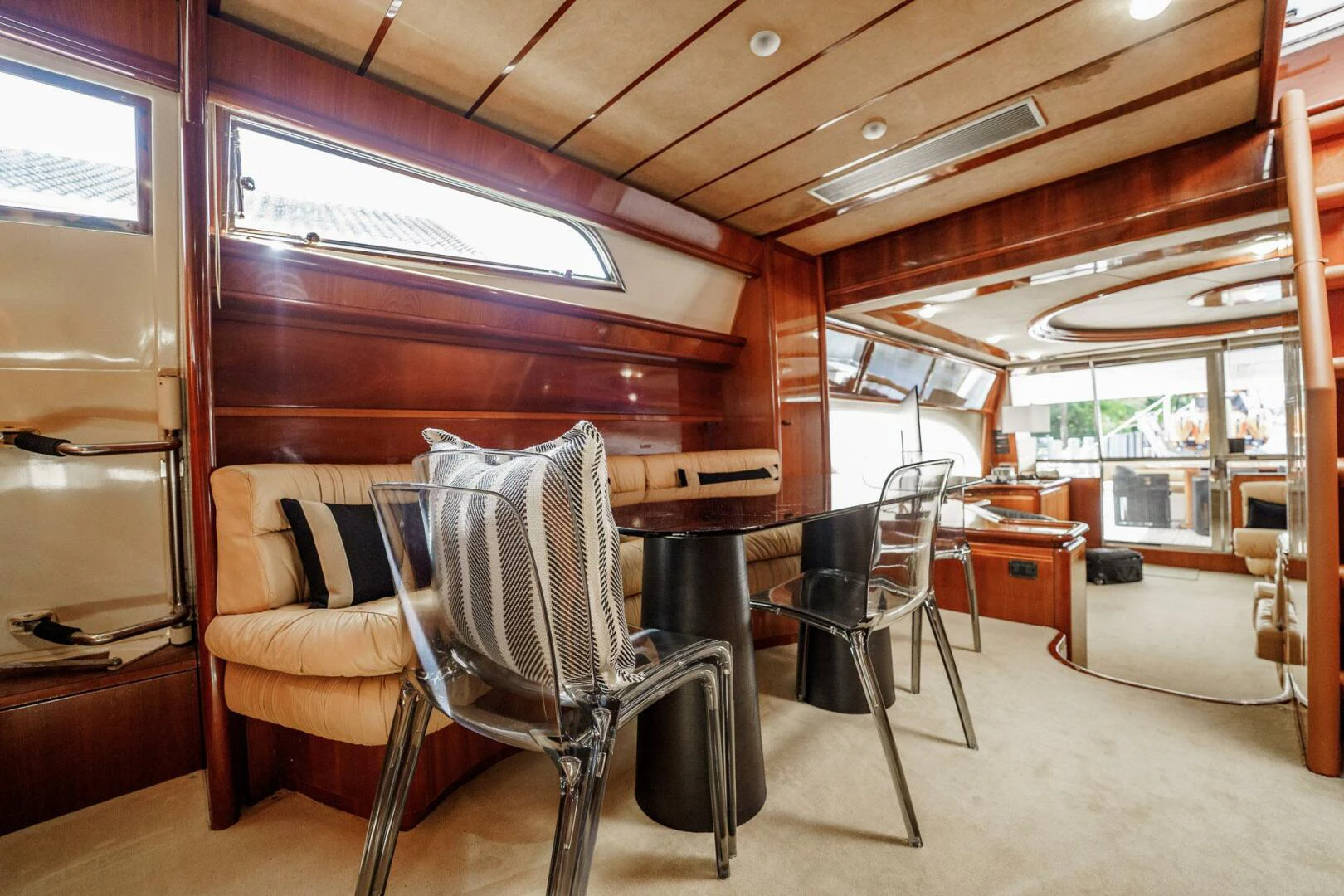 a room with chairs and tables aboard RABBIT Yacht for Sale