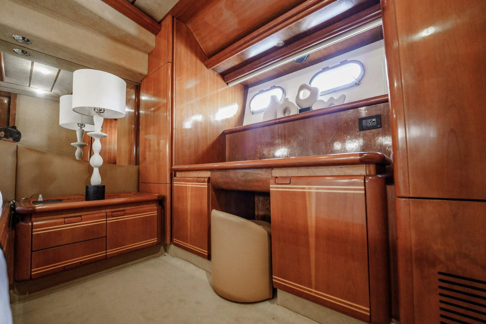 a room with wooden cabinets and a lamp aboard RABBIT Yacht for Sale