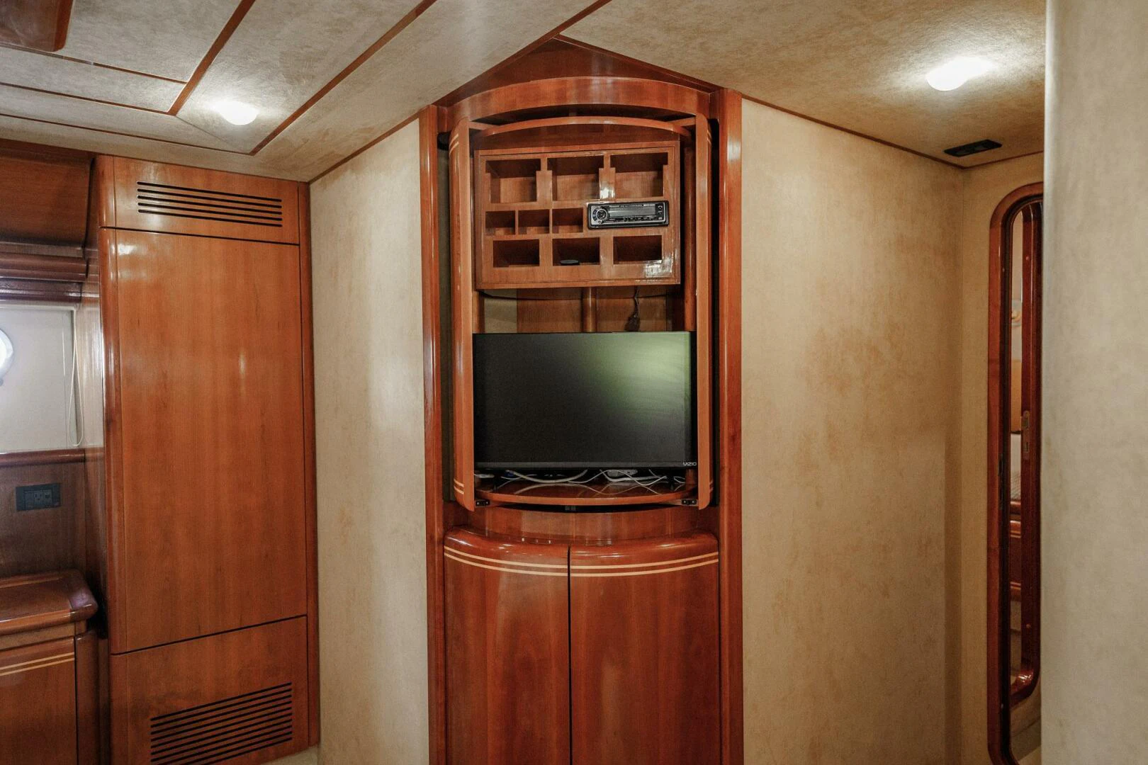 a tv on a stand in a room aboard RABBIT Yacht for Sale