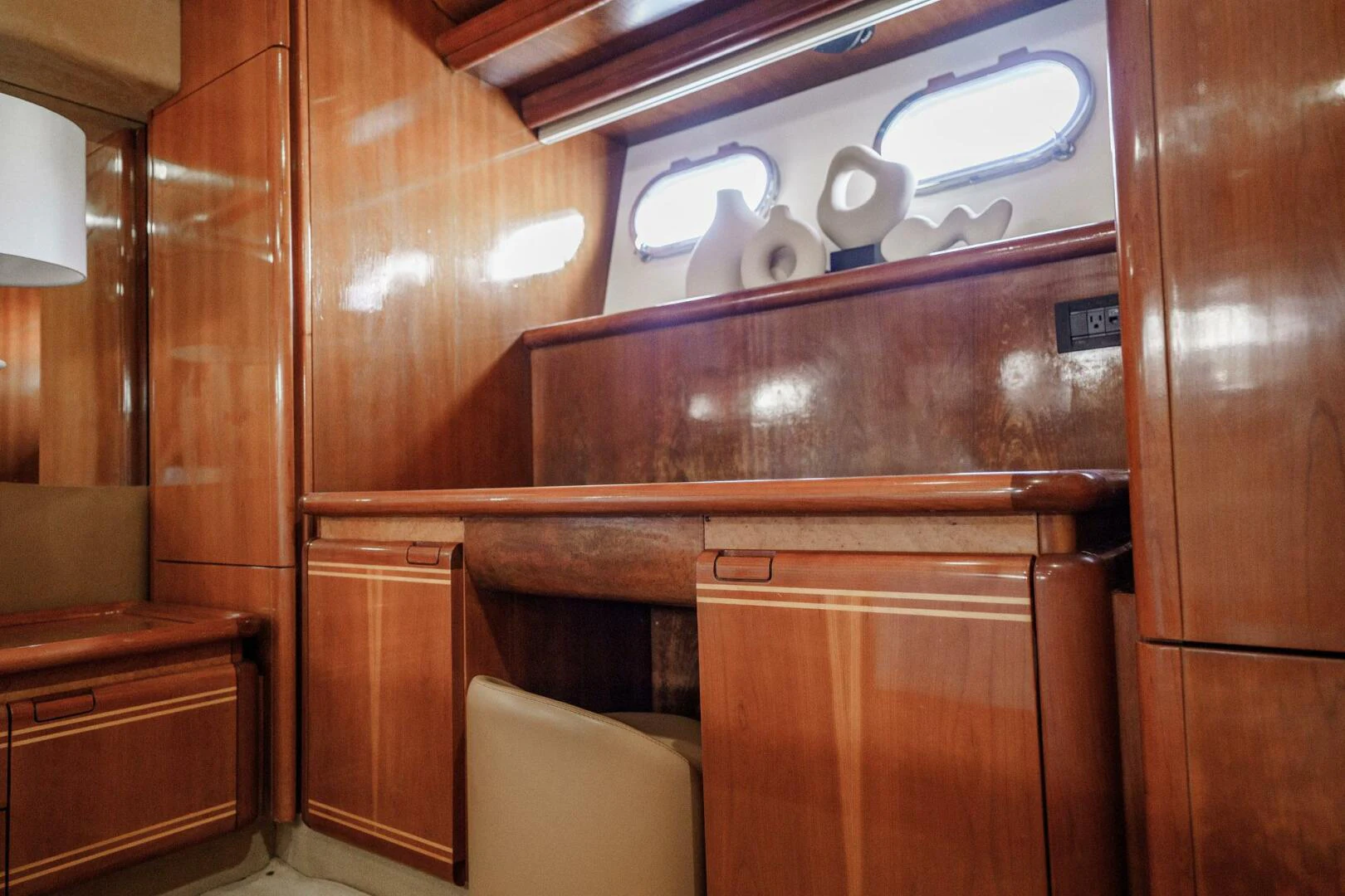 a wooden cabinet with a logo on it aboard RABBIT Yacht for Sale