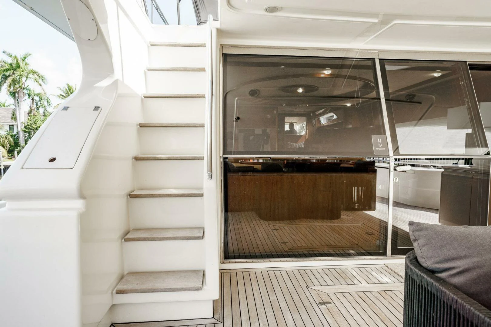 a room with a wood door and a white staircase aboard RABBIT Yacht for Sale