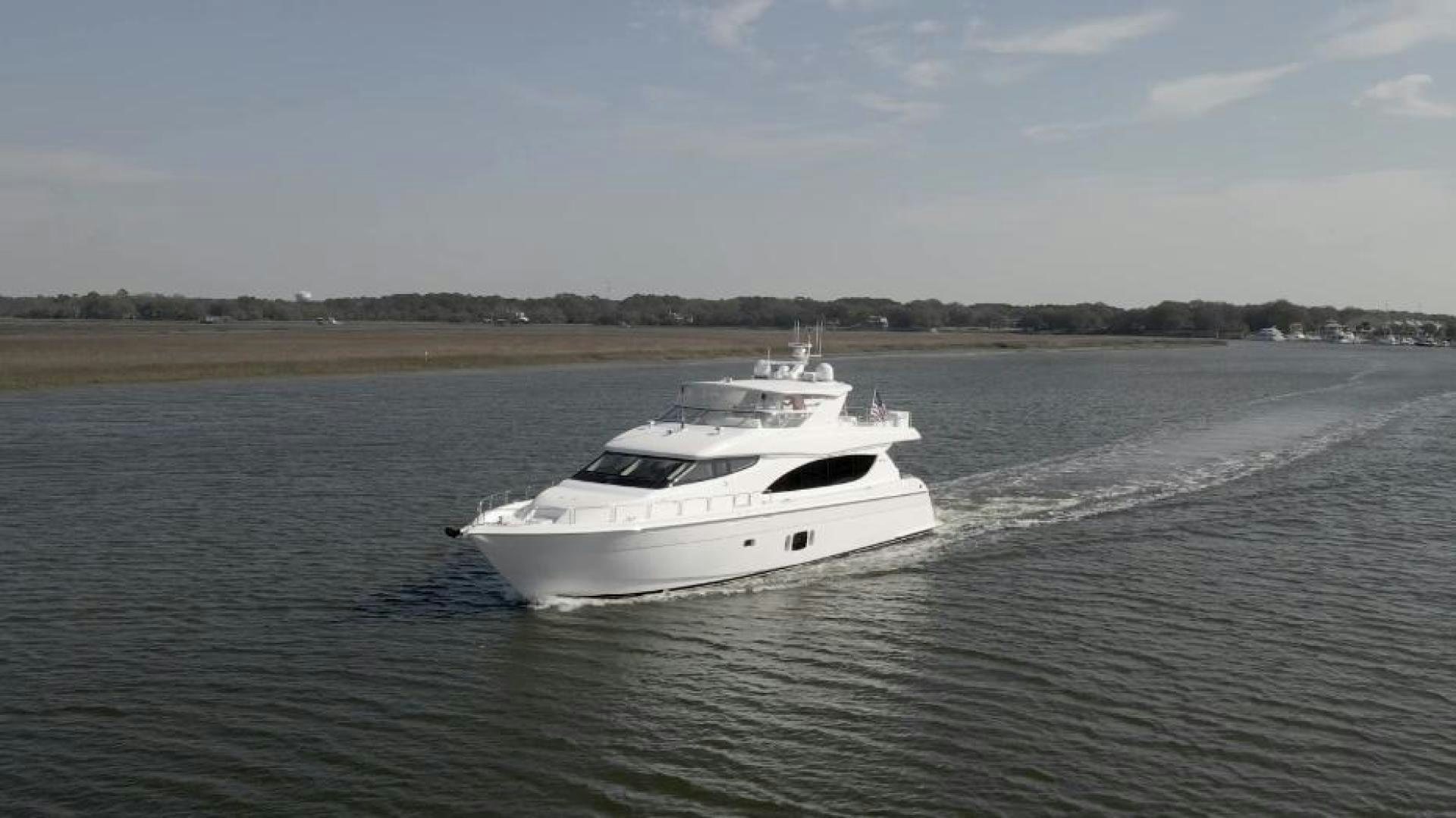 a white yacht on the water aboard FLYNN'S FOLLY III Yacht for Sale