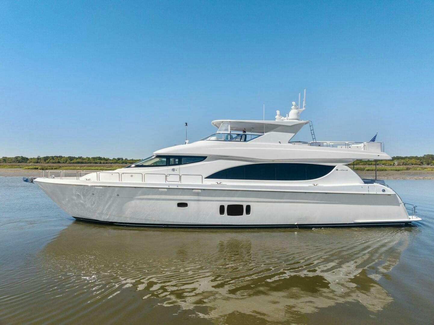 a white boat in a body of water aboard FLYNN'S FOLLY III Yacht for Sale