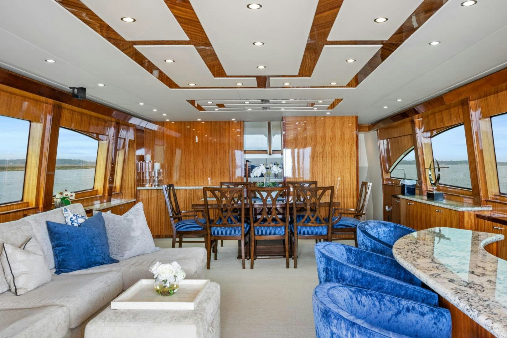 a living room with a table and chairs aboard FLYNN'S FOLLY III Yacht for Sale