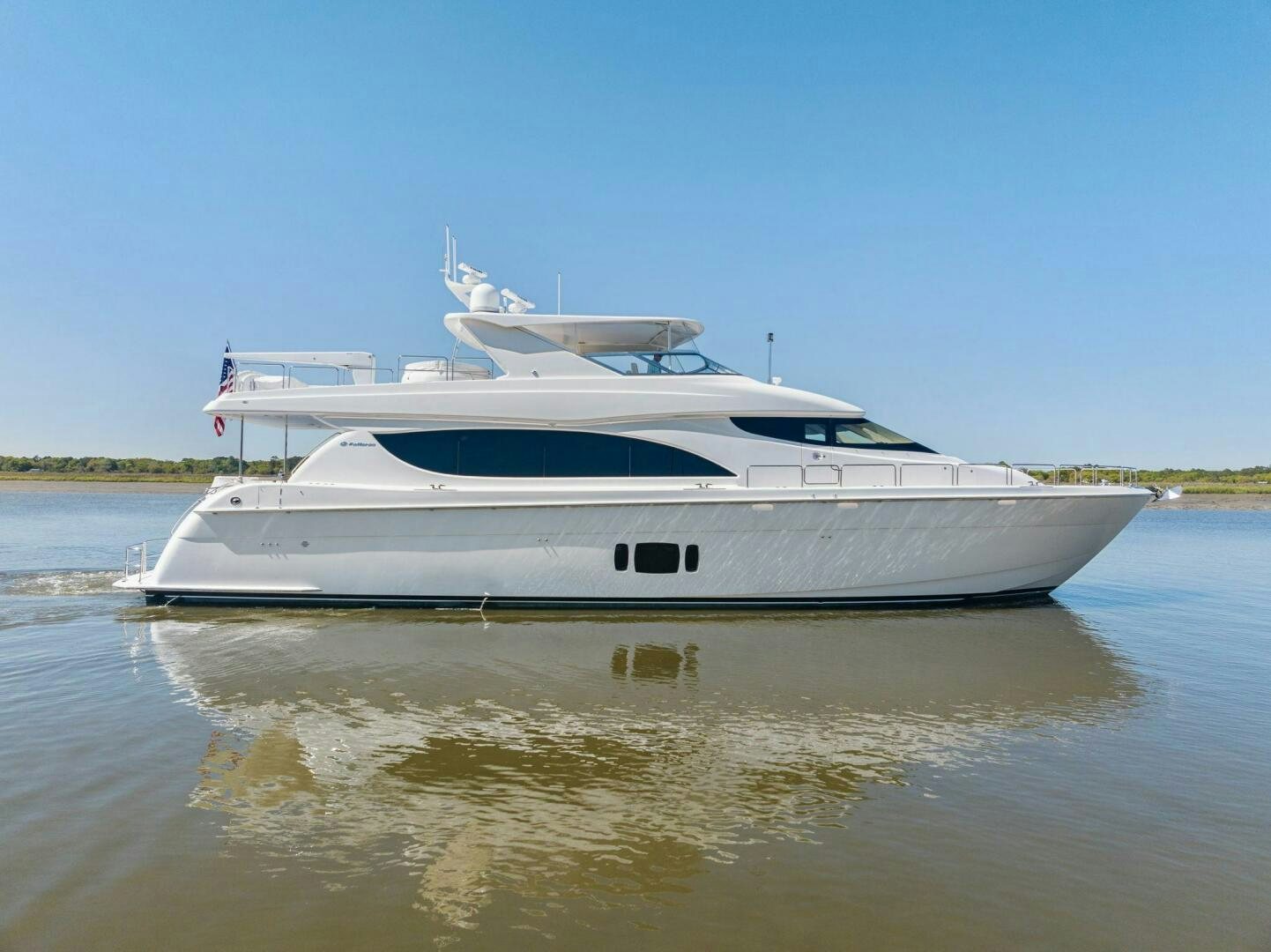 a white boat on a river aboard FLYNN'S FOLLY III Yacht for Sale
