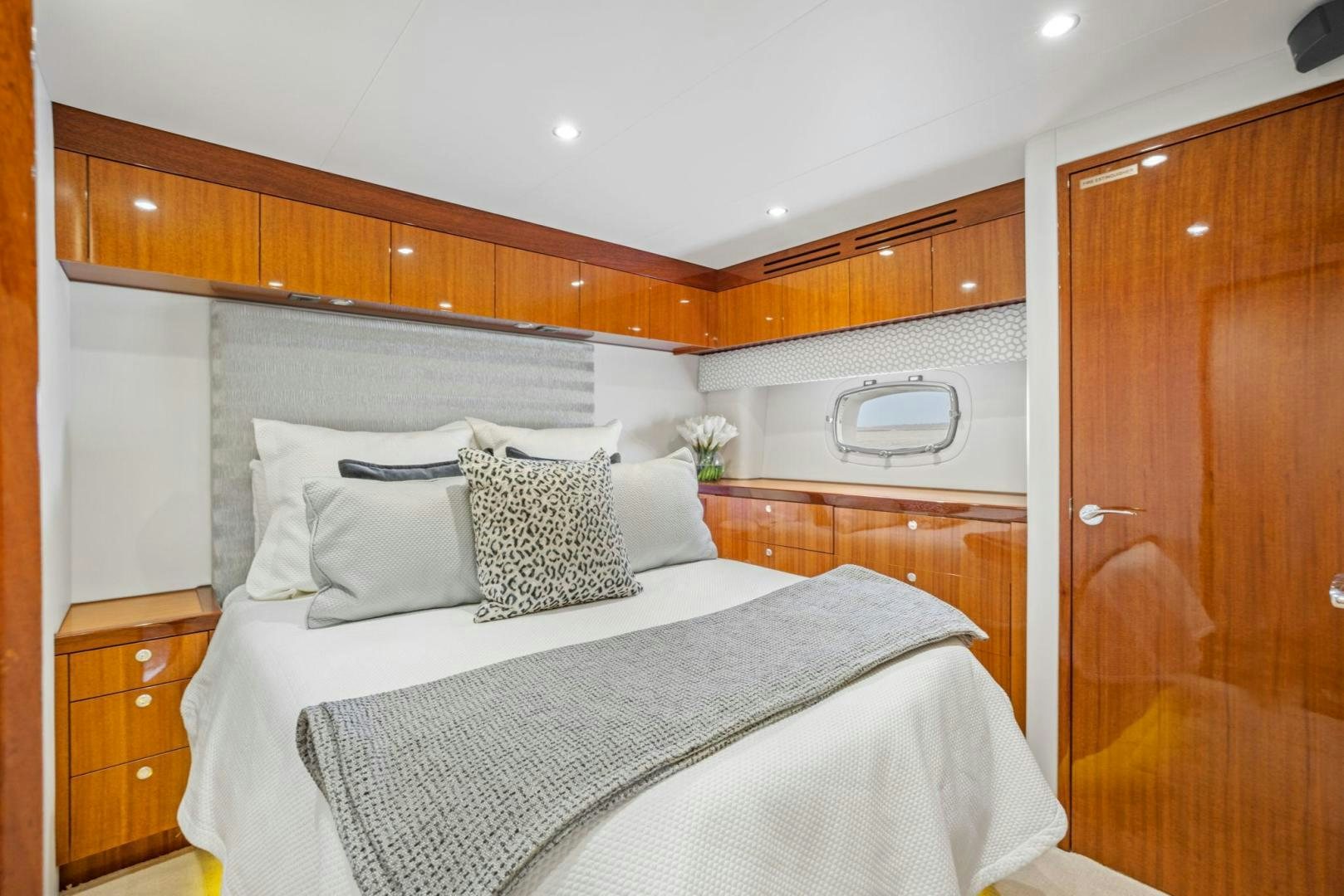 a bed with pillows and a microwave above it aboard FLYNN'S FOLLY III Yacht for Sale