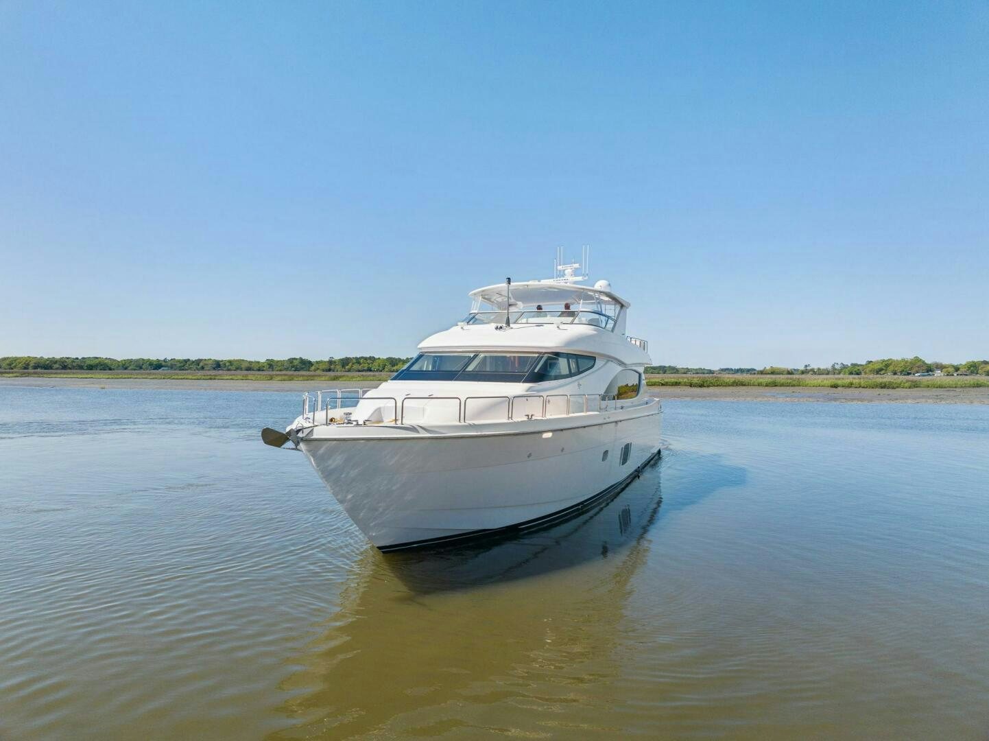 a white boat in the water aboard FLYNN'S FOLLY III Yacht for Sale