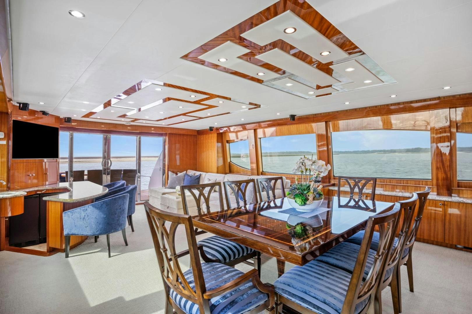 a large room with a table and chairs aboard FLYNN'S FOLLY III Yacht for Sale