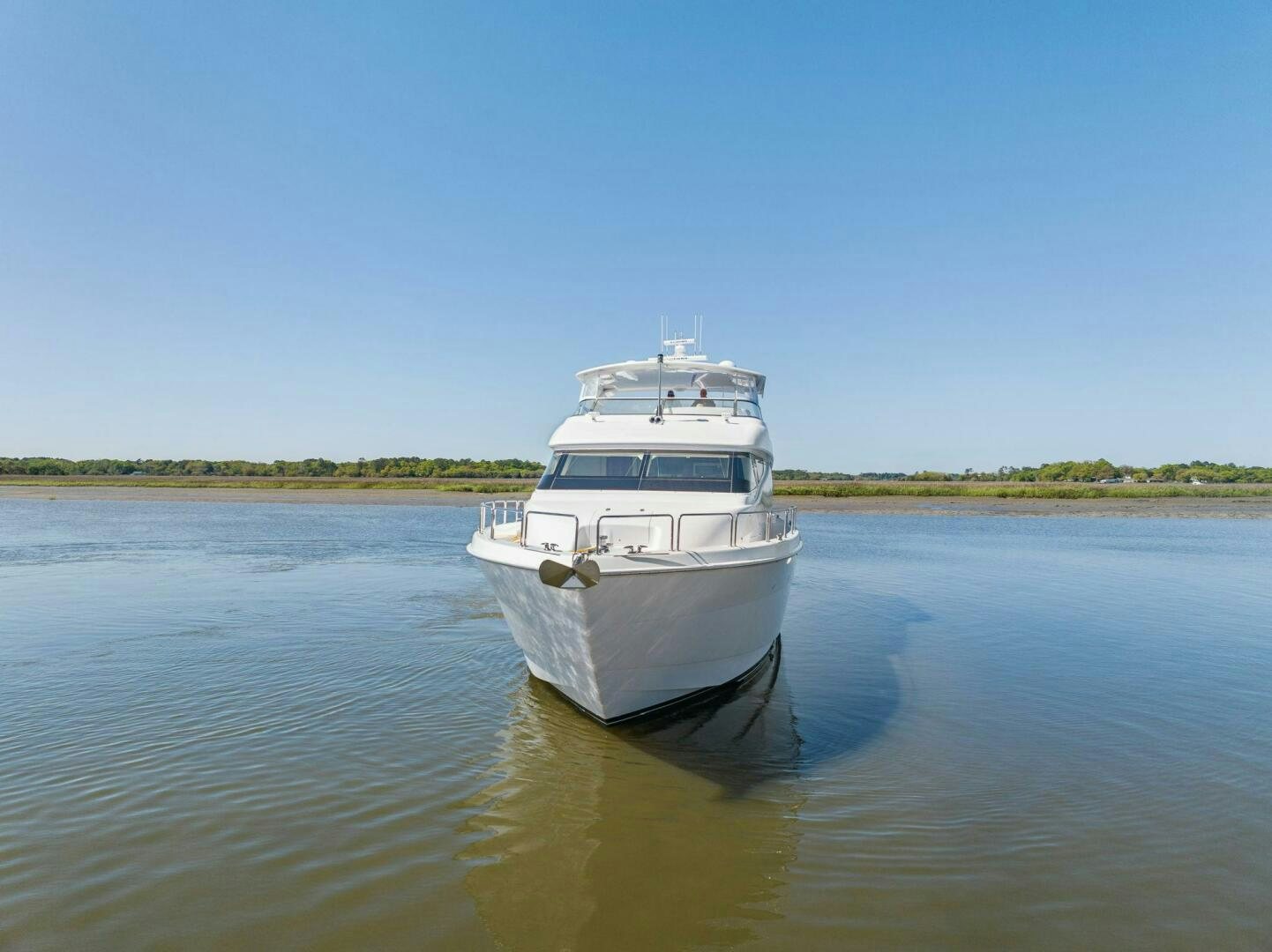 a white boat in the water aboard FLYNN'S FOLLY III Yacht for Sale