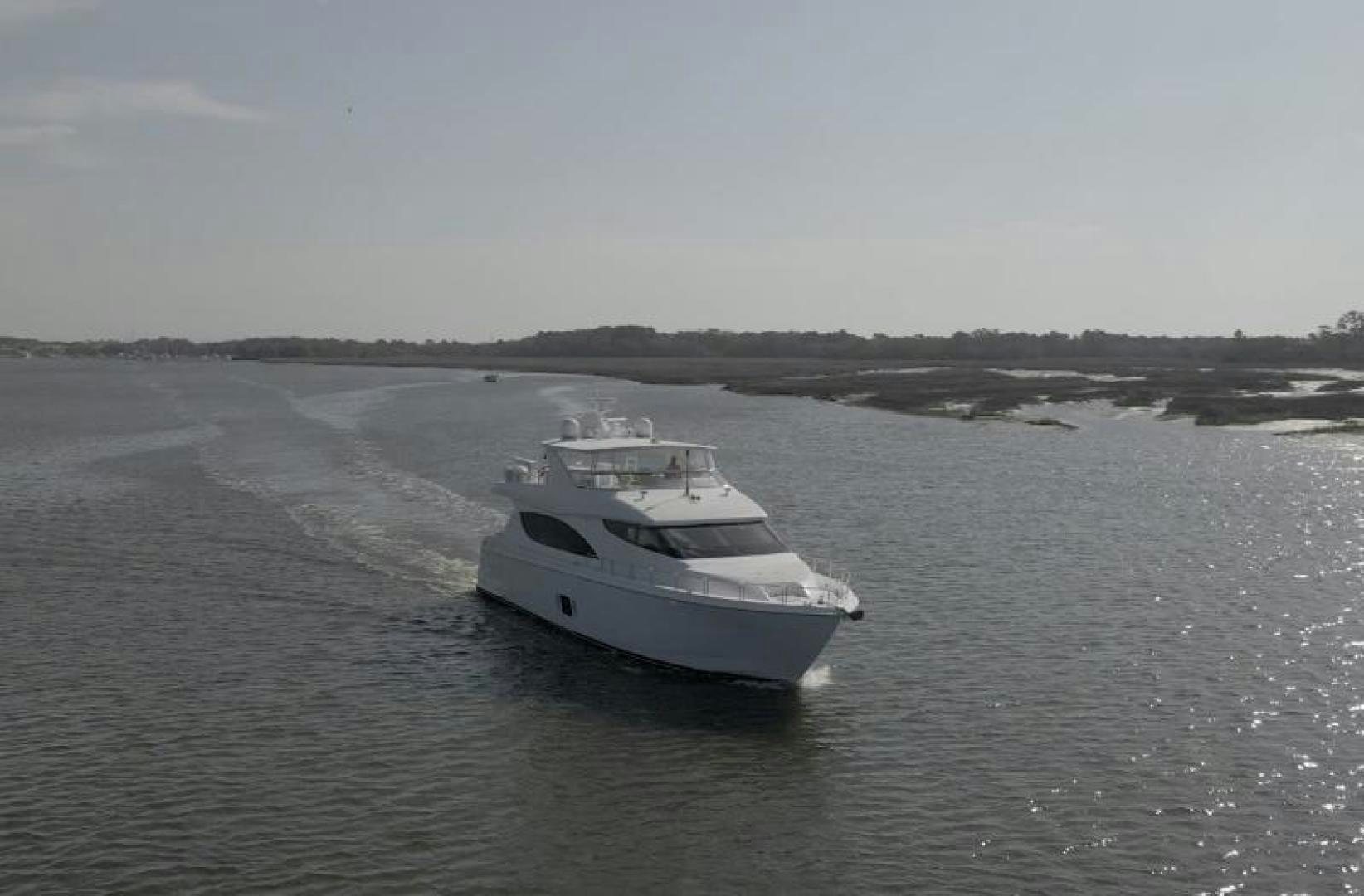 a white boat in the water aboard FLYNN'S FOLLY III Yacht for Sale