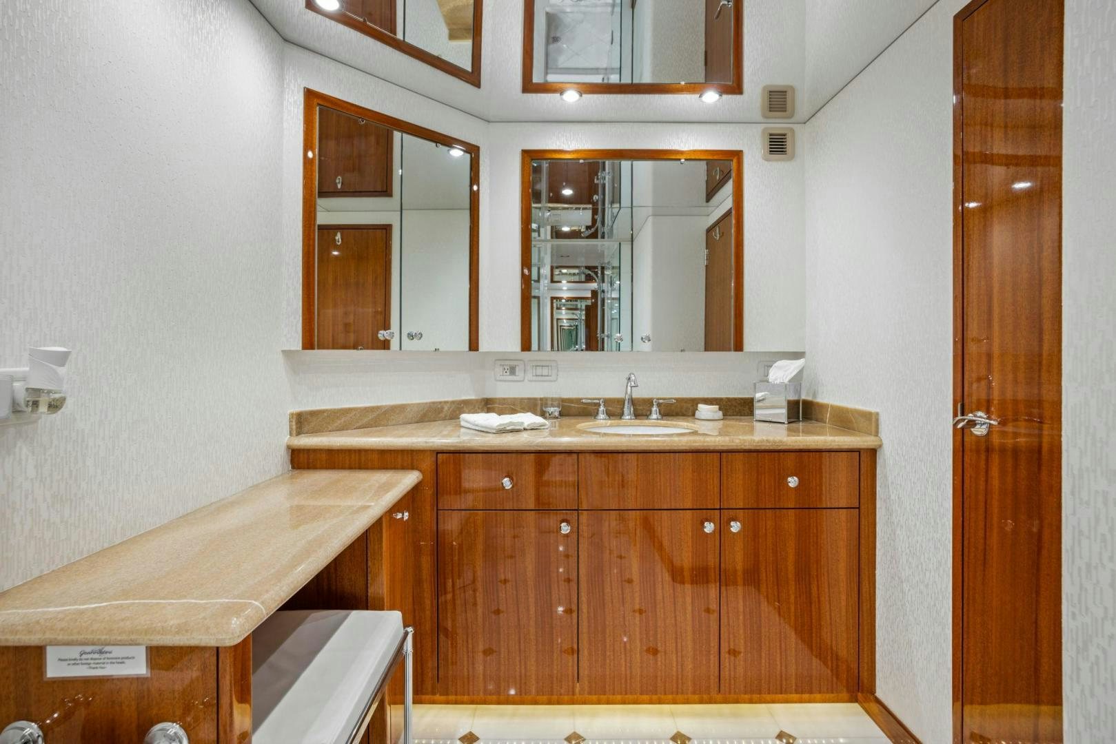 a bathroom with a sink and a mirror aboard FLYNN'S FOLLY III Yacht for Sale