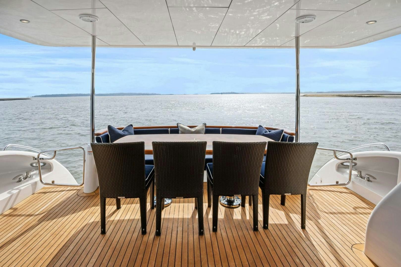 a table and chairs on a deck aboard FLYNN'S FOLLY III Yacht for Sale