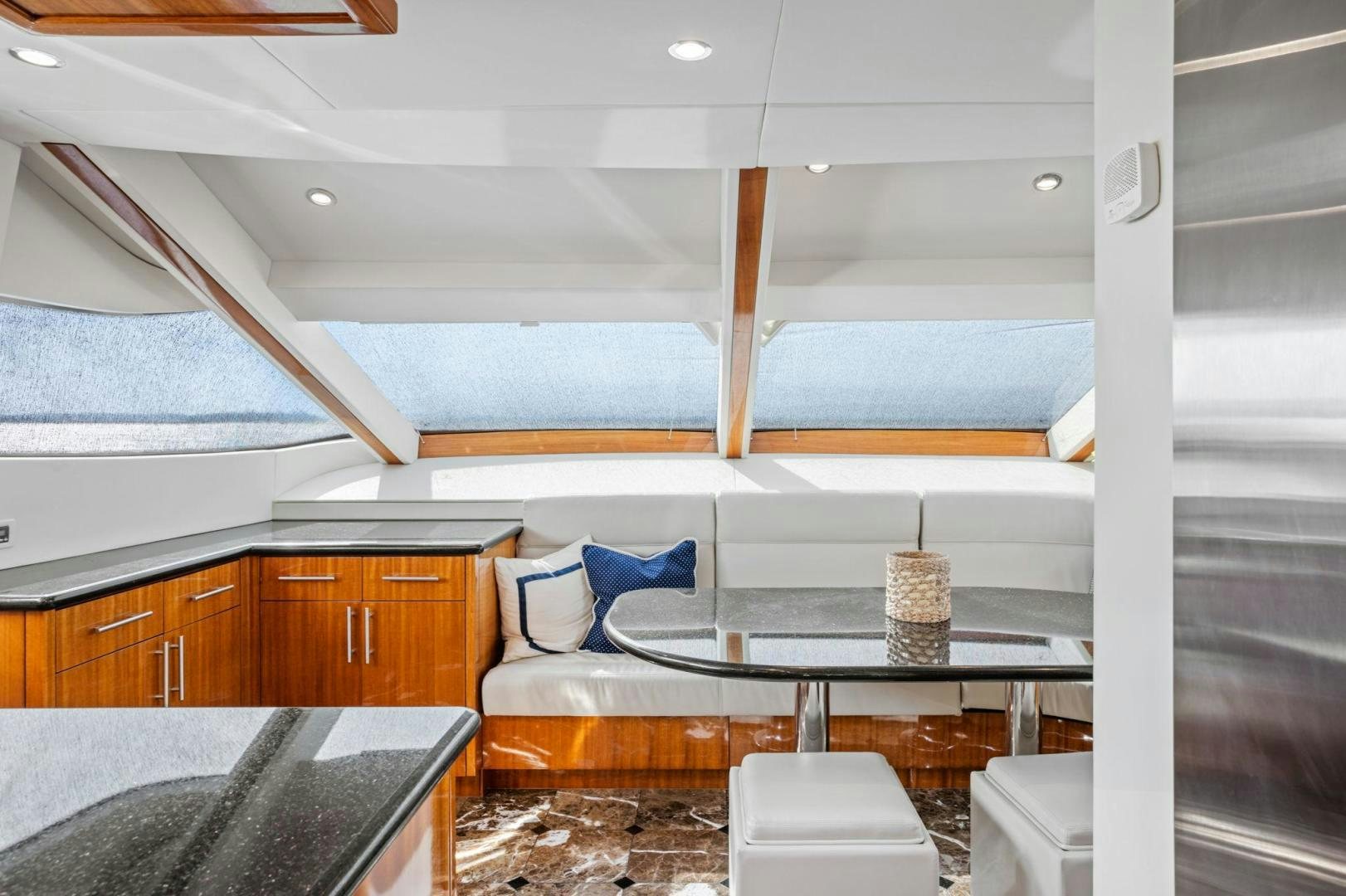 a room with a table and chairs aboard FLYNN'S FOLLY III Yacht for Sale