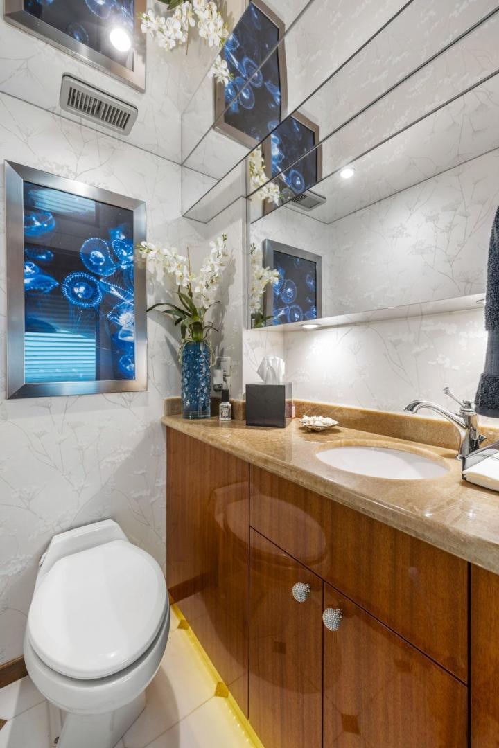 a bathroom with a toilet and sink aboard FLYNN'S FOLLY III Yacht for Sale