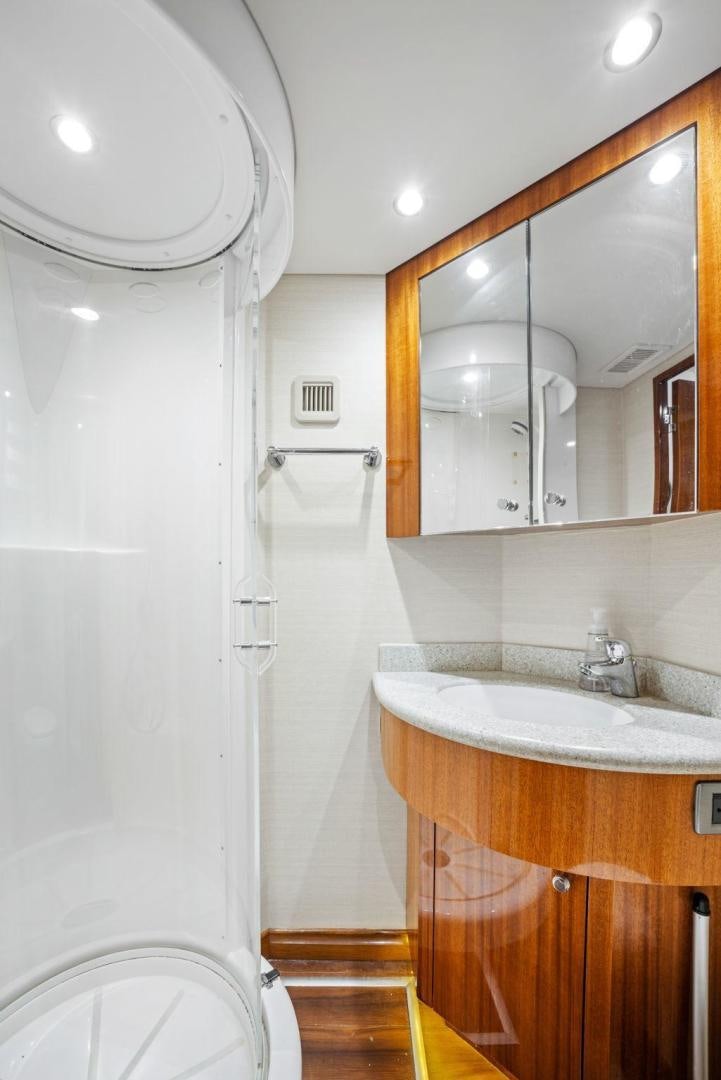 a bathroom with a sink and a mirror aboard FLYNN'S FOLLY III Yacht for Sale
