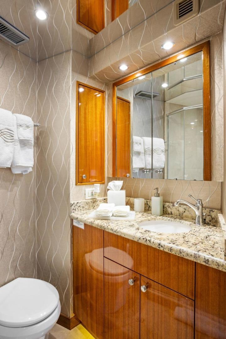a bathroom with a large mirror aboard FLYNN'S FOLLY III Yacht for Sale