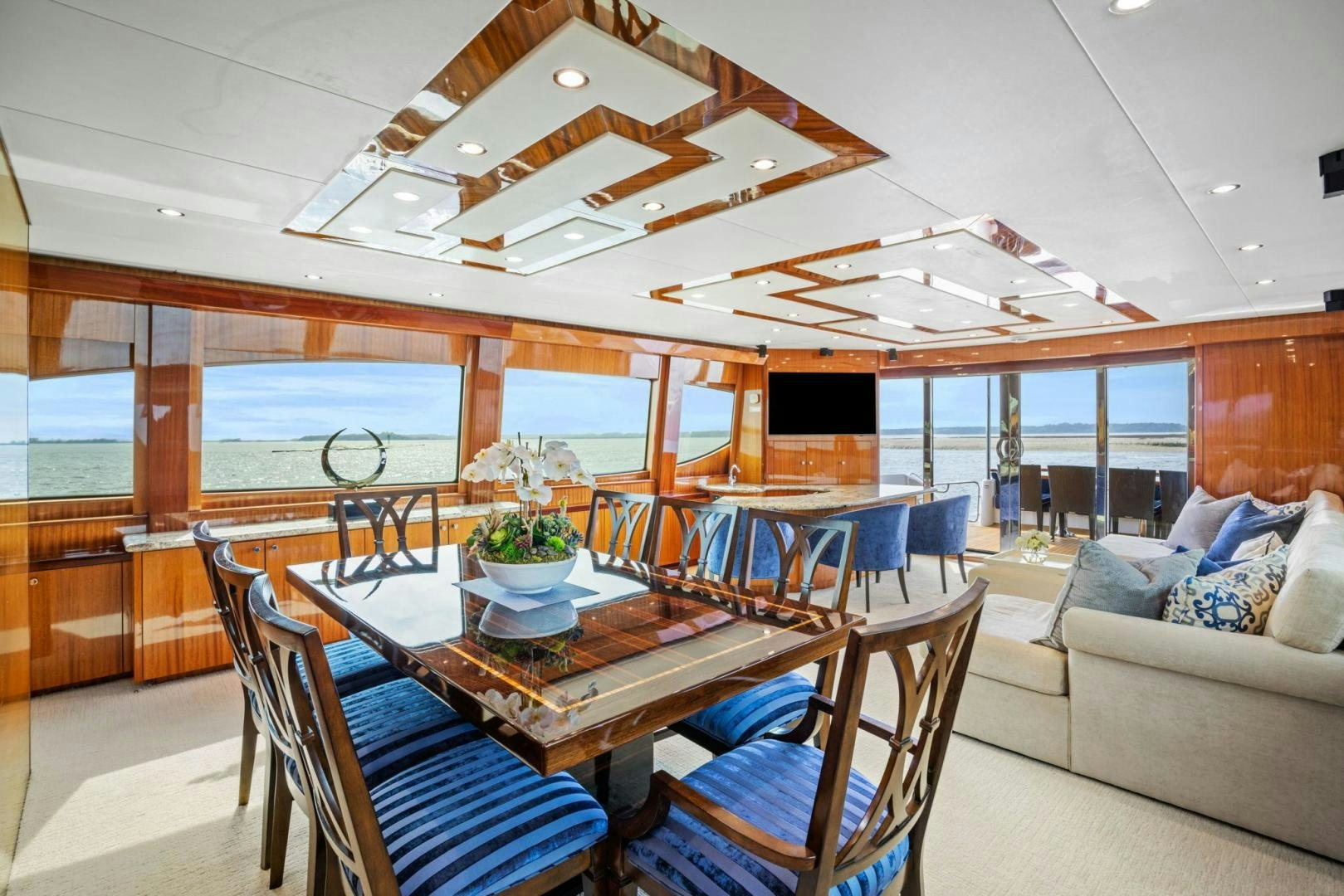 a large dining table in a living room aboard FLYNN'S FOLLY III Yacht for Sale
