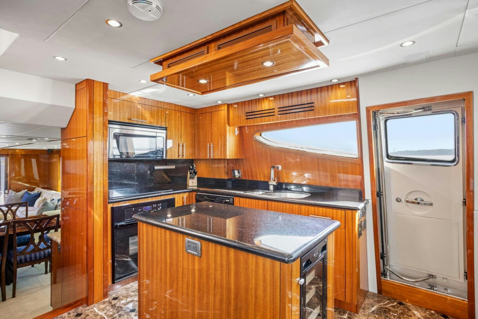 a kitchen with wooden cabinets aboard FLYNN'S FOLLY III Yacht for Sale