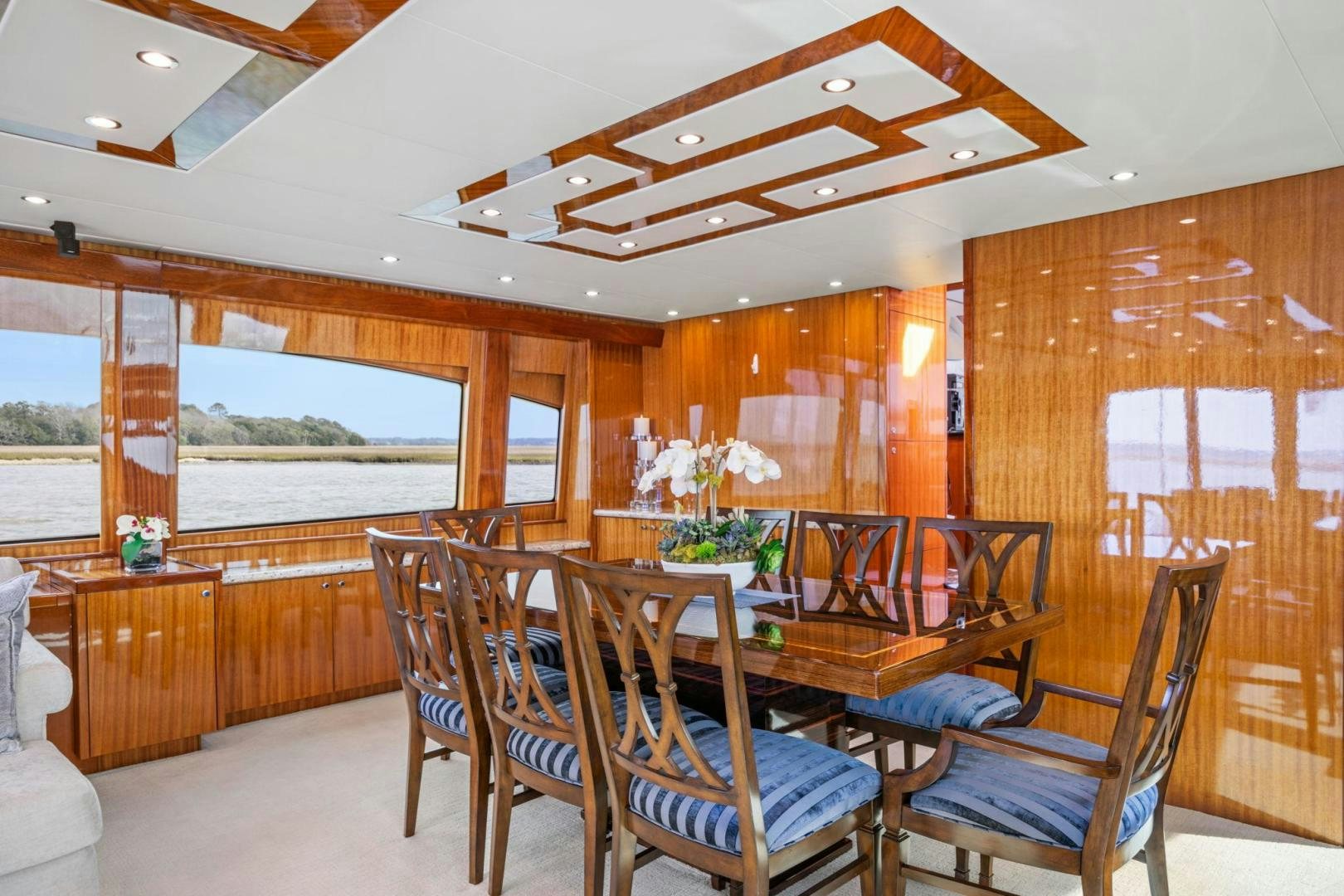 a dining room with a large open window aboard FLYNN'S FOLLY III Yacht for Sale