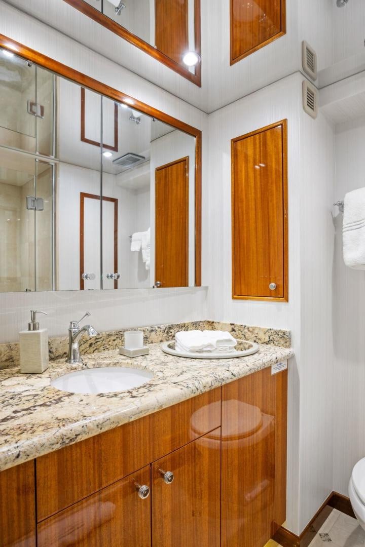 a bathroom with a mirror aboard FLYNN'S FOLLY III Yacht for Sale