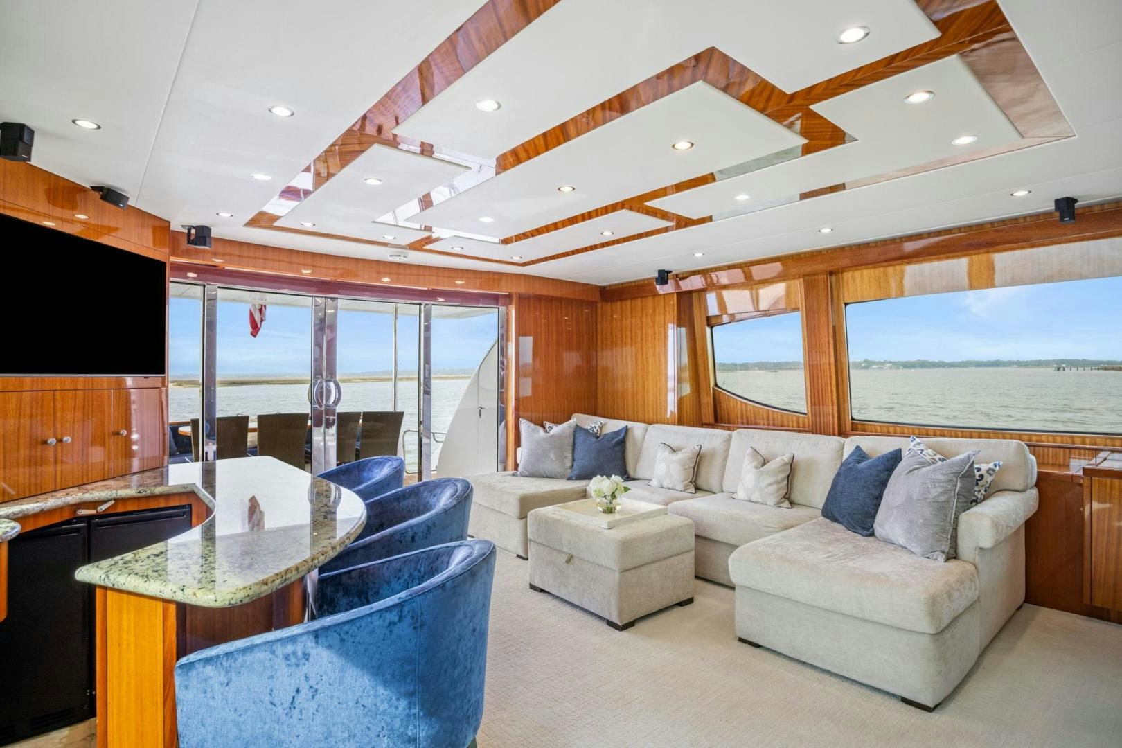 a living room with a large window aboard FLYNN'S FOLLY III Yacht for Sale