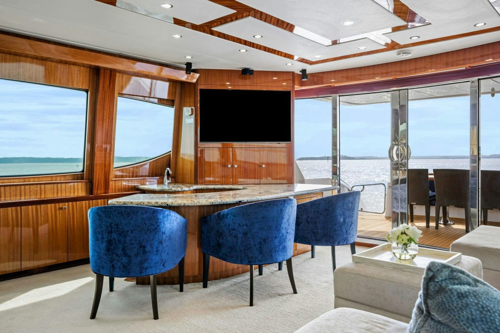 a room with a table and chairs aboard FLYNN'S FOLLY III Yacht for Sale