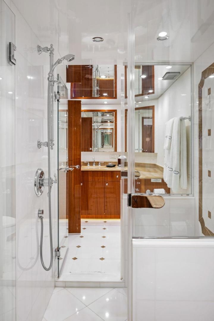 a bathroom with a shower unit and sink aboard FLYNN'S FOLLY III Yacht for Sale