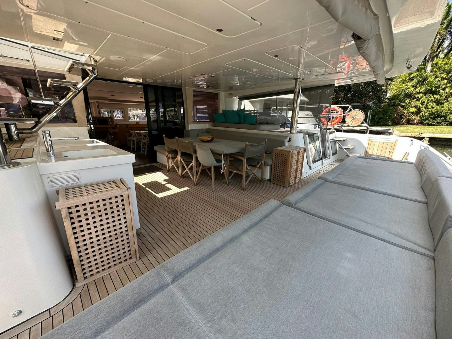 a couch and a table in a room aboard OCEAN VIEW Yacht for Sale