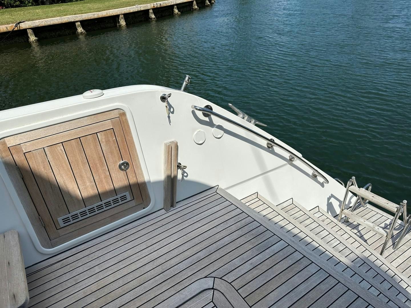 a white boat on a dock aboard OCEAN VIEW Yacht for Sale