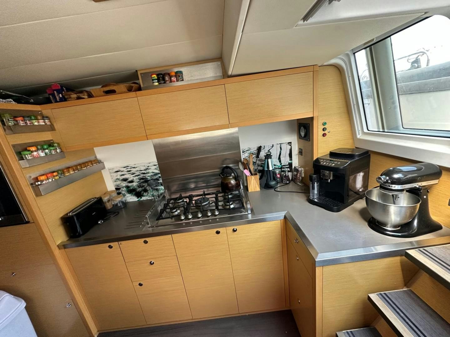a kitchen with wooden cabinets aboard OCEAN VIEW Yacht for Sale