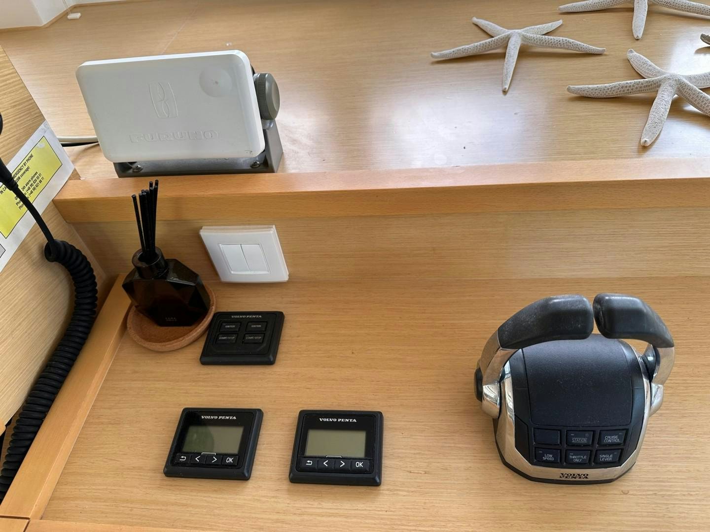 a group of electronic devices on a table aboard OCEAN VIEW Yacht for Sale