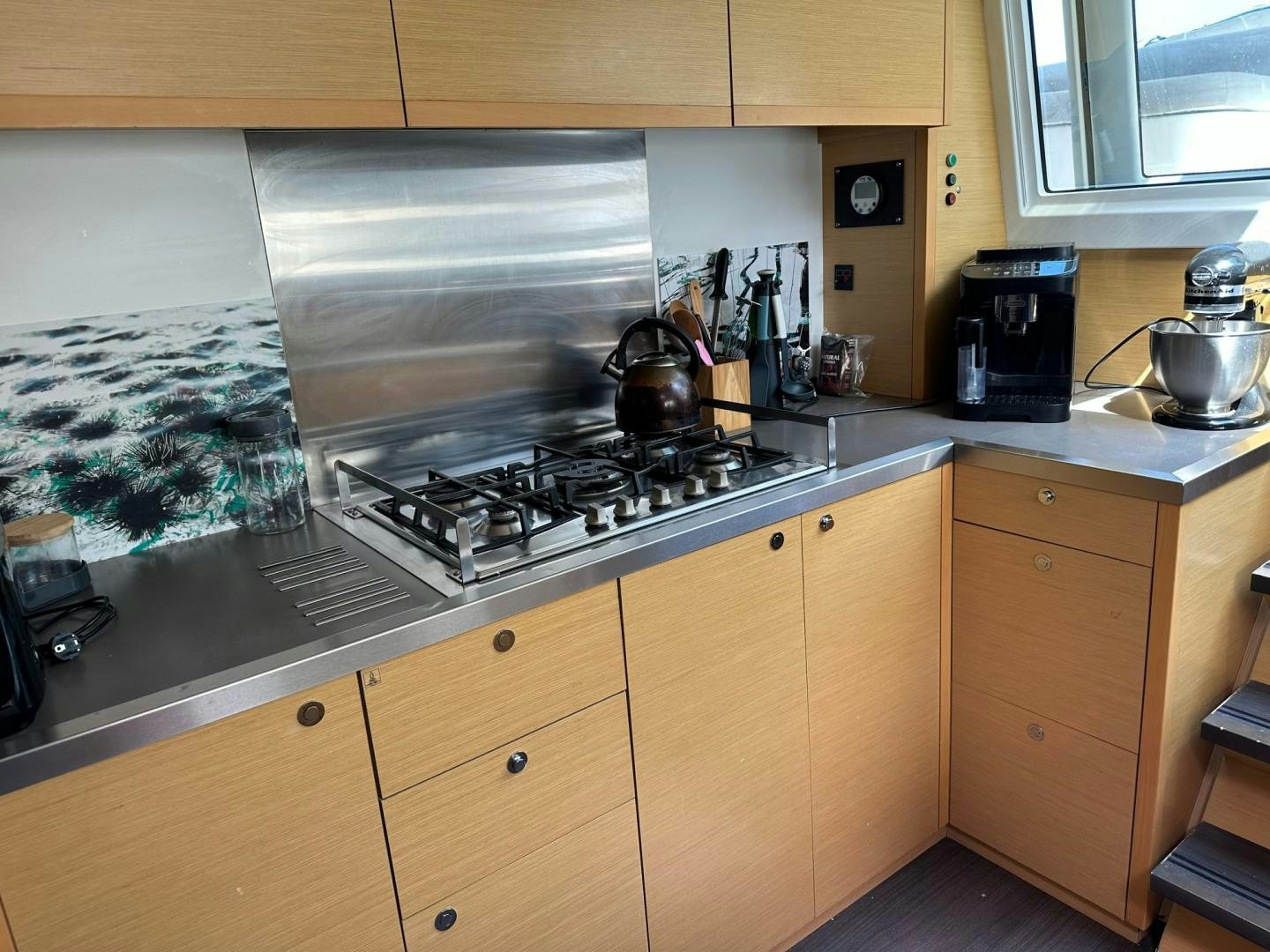 a kitchen with a stove and cabinets aboard OCEAN VIEW Yacht for Sale