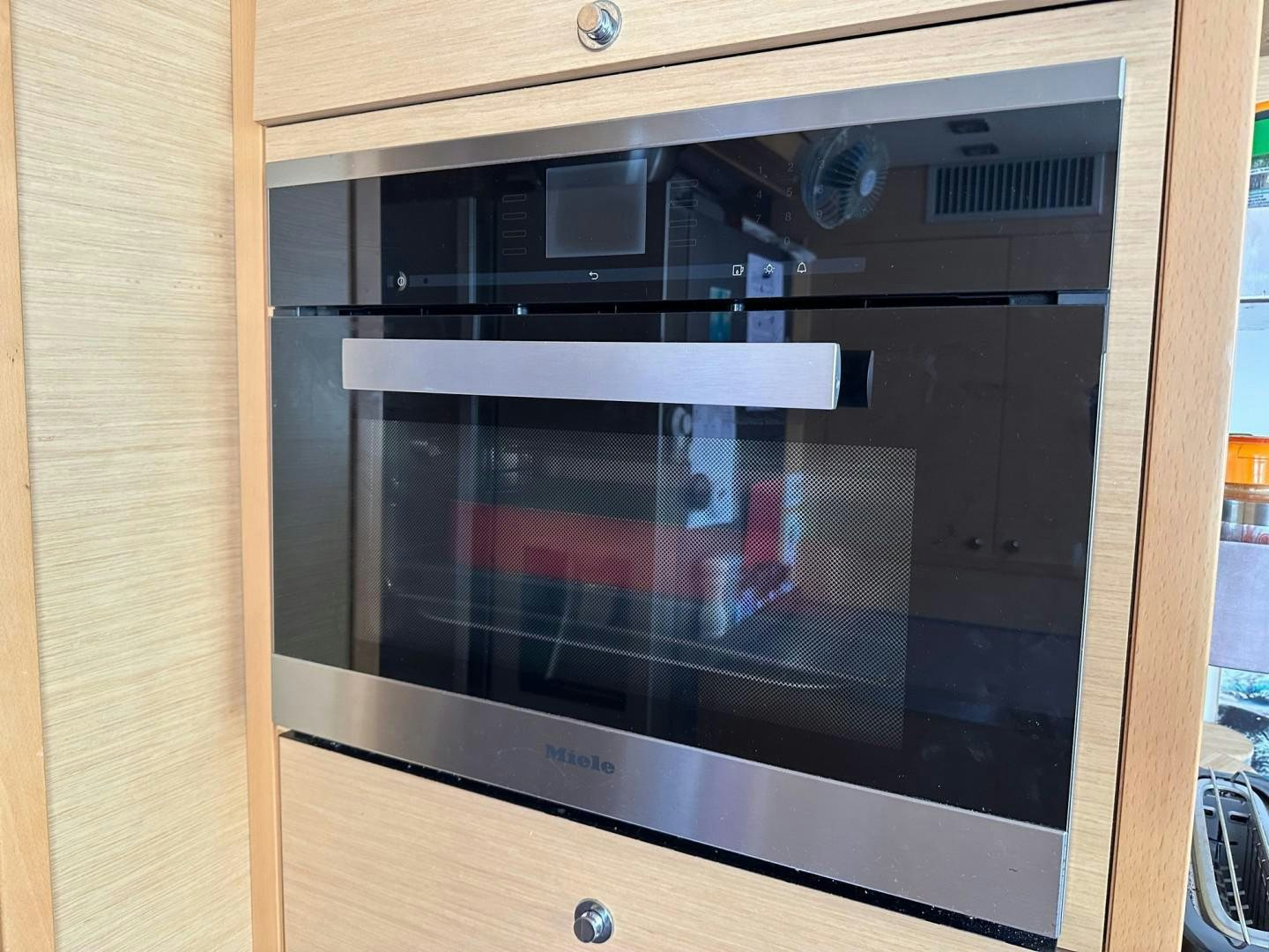 a black oven with a silver door aboard OCEAN VIEW Yacht for Sale