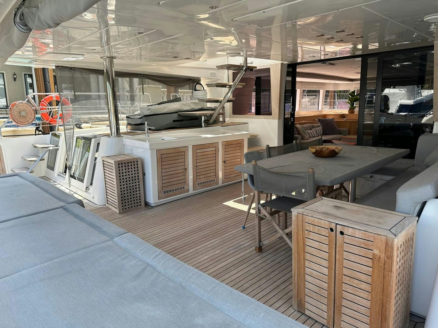 a room with a table and chairs aboard OCEAN VIEW Yacht for Sale