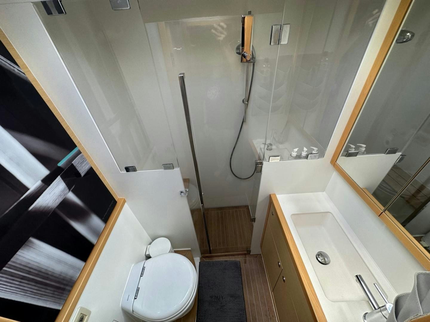 a bathroom with a toilet and bathtub aboard OCEAN VIEW Yacht for Sale