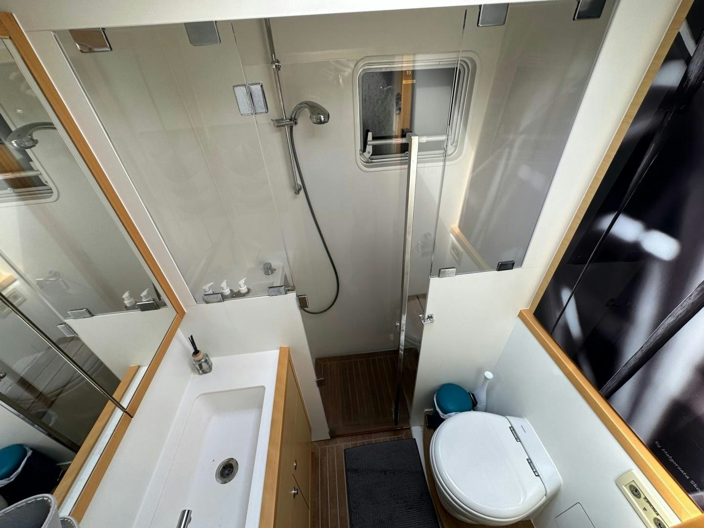 a bathroom with a toilet and bathtub aboard OCEAN VIEW Yacht for Sale